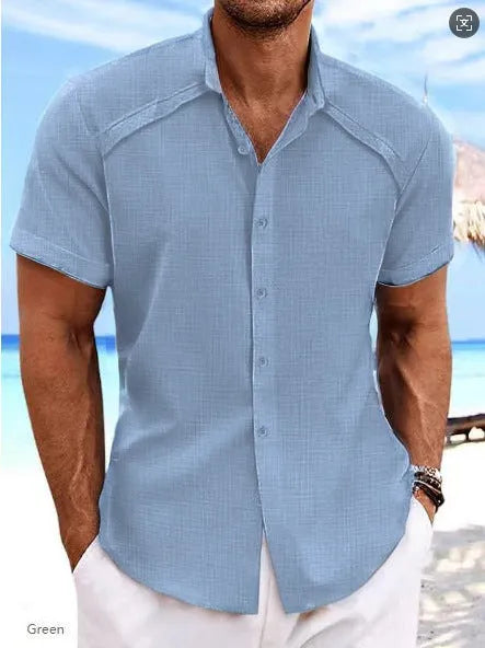 Man wearing a solid colour short sleeve Hawaiian casual shirt in a cotton blend fabric.