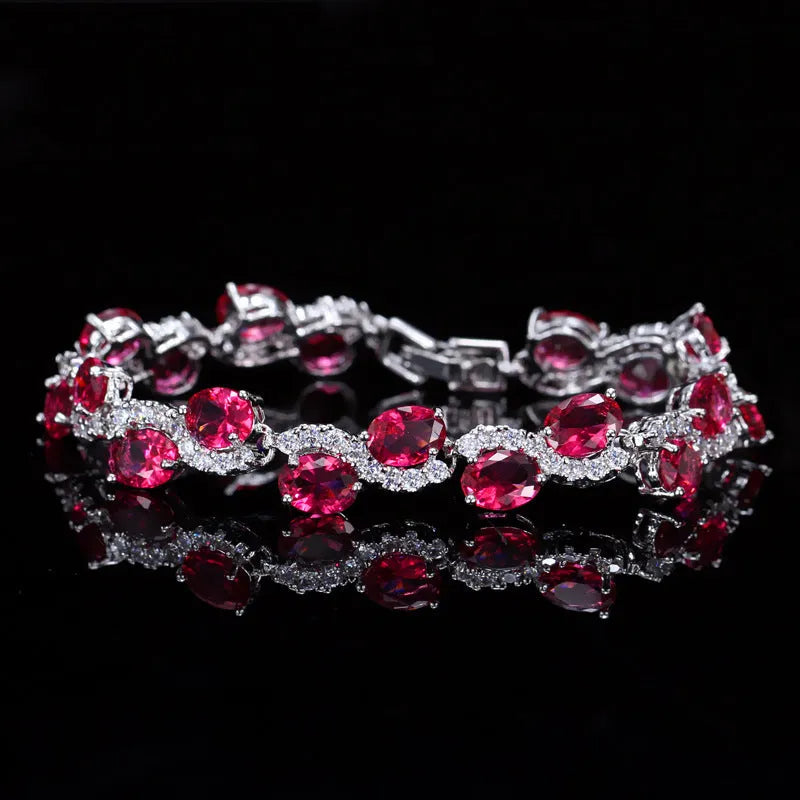 Copper plated gold bracelet with AAA+ zircon stones in a simple geometric design.