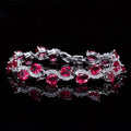 Copper plated gold bracelet with AAA+ zircon stones in a simple geometric design.