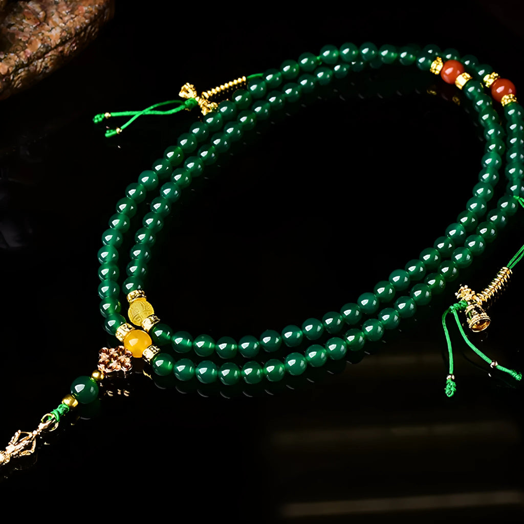 Close-up of a multi-circle green agate bracelet for men and women on a wrist.