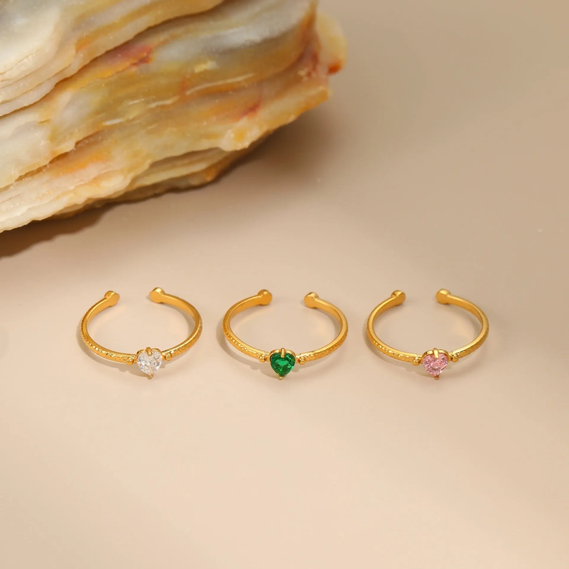 Open-ended stainless steel ring with geometric heart shape and inlaid zircon stones
