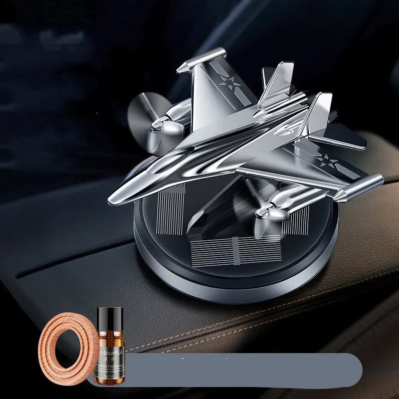 Solar powered rotating fighter aircraft car perfume ornament in silver, gold, blue, or red colours