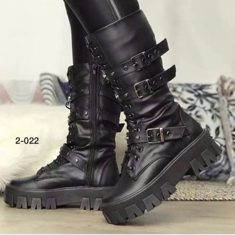 Black women's mid-calf boots with a large metal buckle and side zipper, featuring a round toe.
