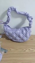 Women's lightweight nylon underarm messenger bag in a solid colour with an adjustable long shoulder strap.