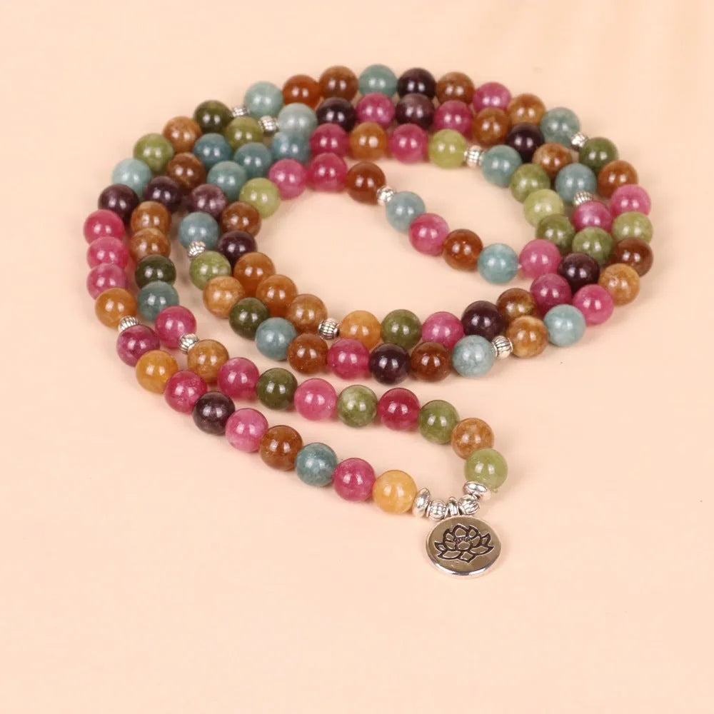108-bead multi-layer lotus hanging bracelet in a tourmaline colour with alloy construction.