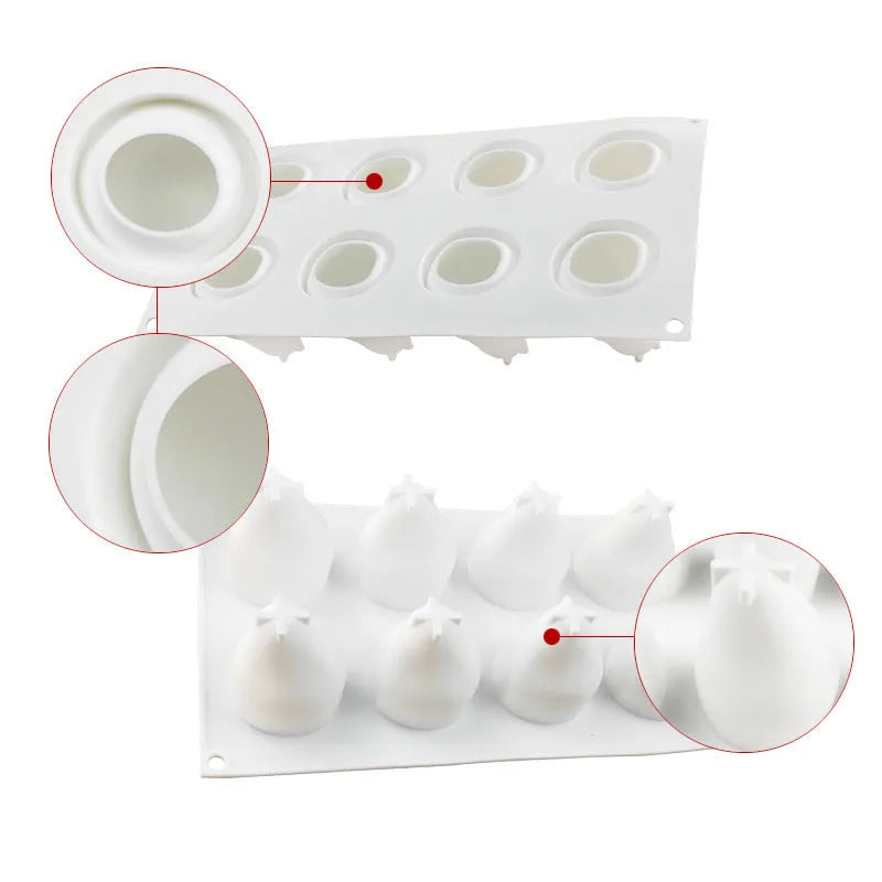 Set of six silicone baking moulds shaped like a pineapple, a pine cone, and a pear on a kitchen counter.