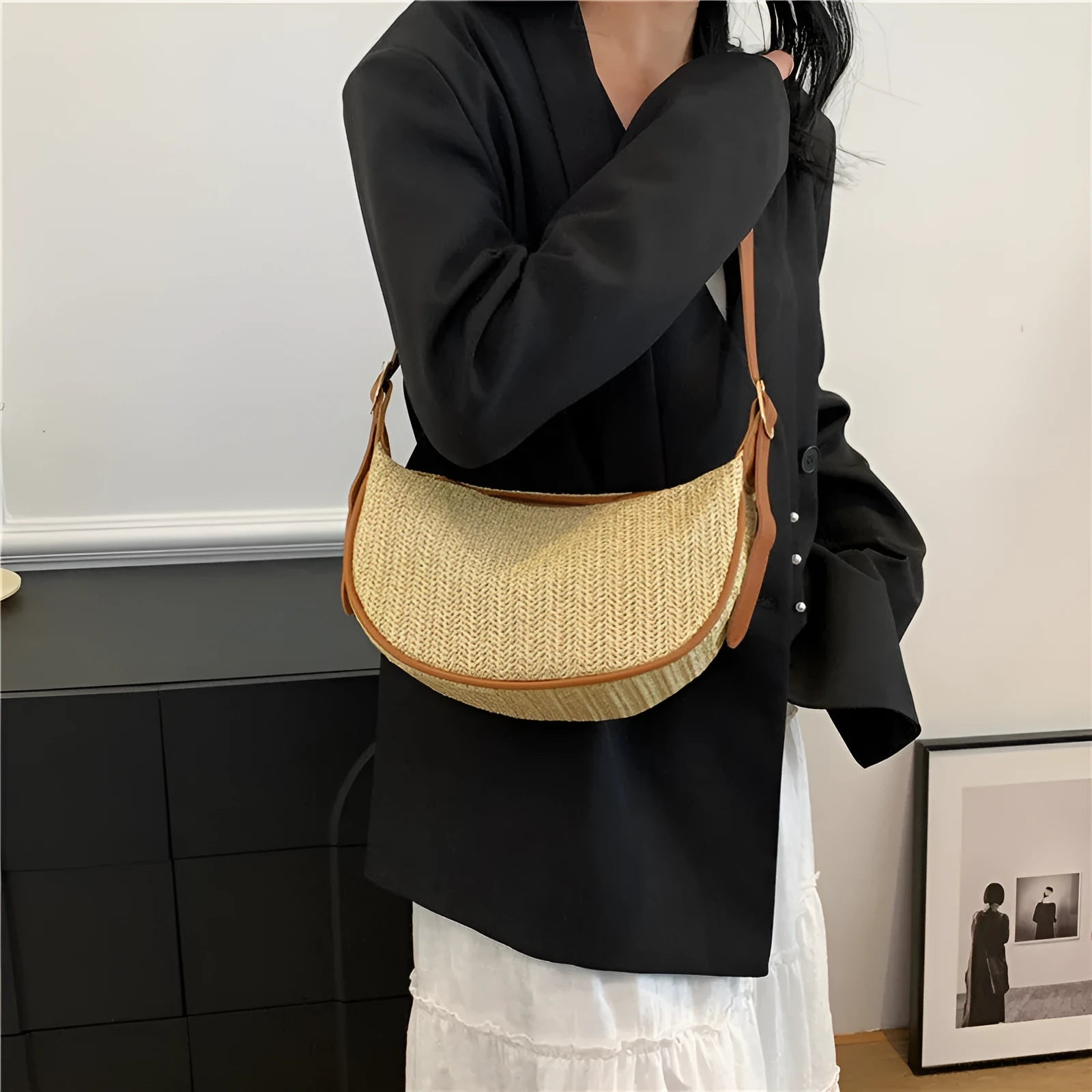 Women's knitted straw woven crossbody bag in corrugated black carrying phone and files
