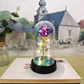 Small plastic night lamp with glass cover and decorative flowers, 15cm tall on black base