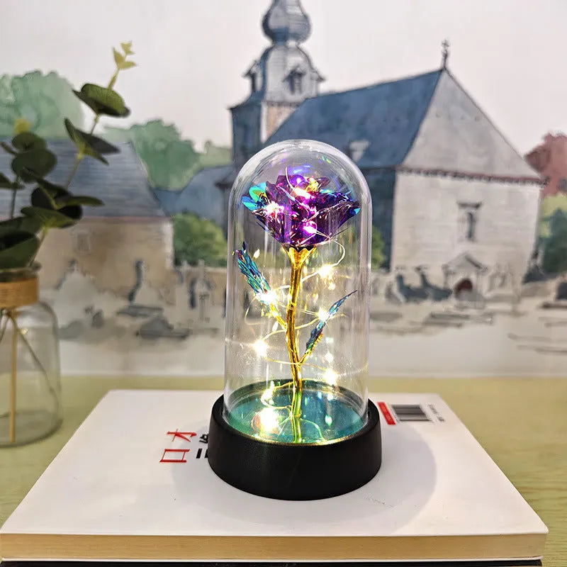 Small plastic night lamp with glass cover and decorative flowers, 15cm tall on black base