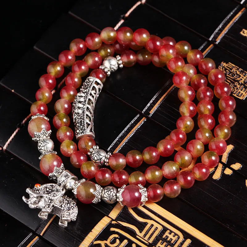 Handcrafted watermelon crystal bracelet with Chinese knot design in geometric shapes