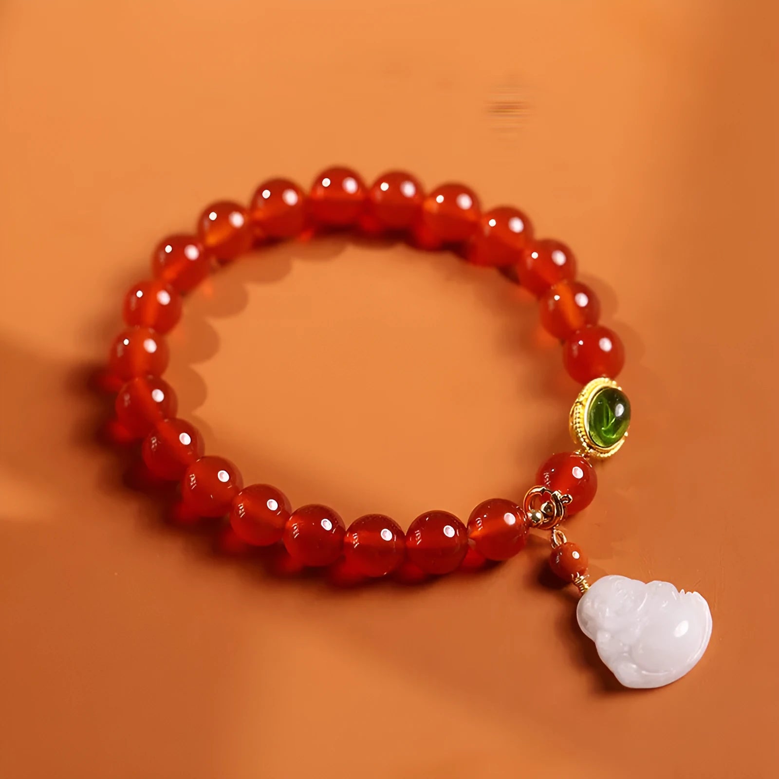 Red agate and amber bracelet with geometric Chinese design and Maitreya Buddha charm