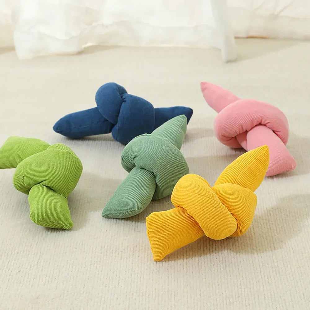 Natural white cotton dog rope toy with multiple sturdy knots for tug play and chewing