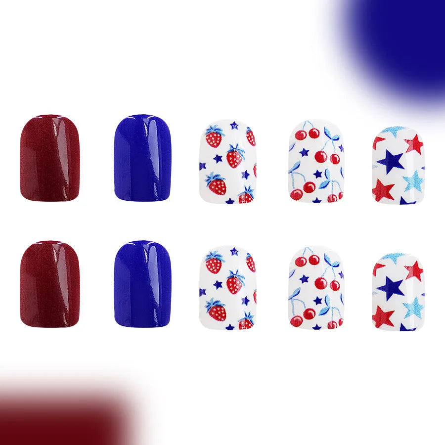 Set of 24 glossy red and blue press-on nail stickers with a strawberry pattern design for Independence Day.