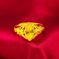 Gold coloured electroplated brass ring with a geometric open diamond flower design and textured details.