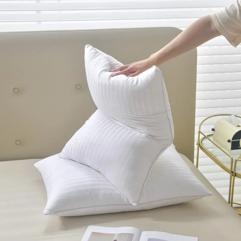 White hotel cotton satin stripe pillow core with feather and cotton filler shown in three size options.