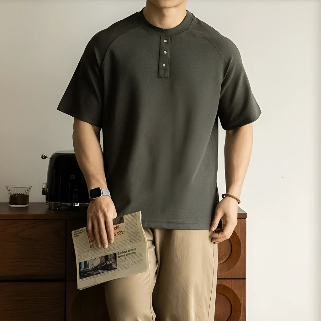 Casual loose-fitting pullover top with raglan sleeves in terry texture fabric shown in smoky grey colour