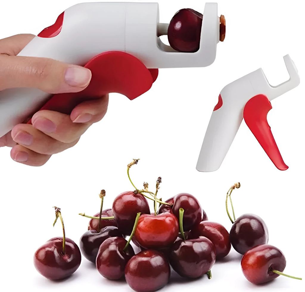 Close-up of a manual cherry pitter tool showing plastic handle and stainless steel mechanism.