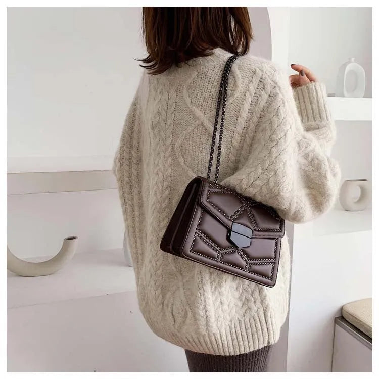 Small square PU shoulder bag with gold rivet studs, chain handle and zipper closure, available in four colours