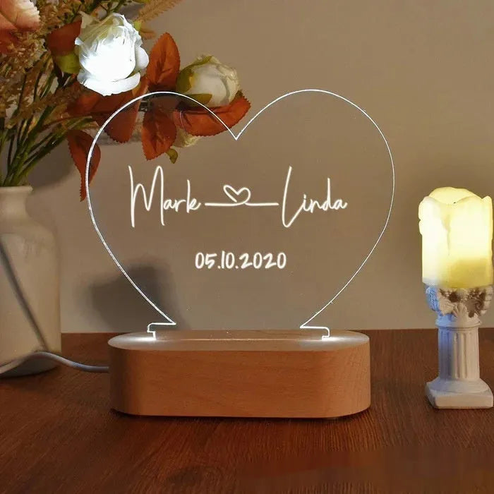 Custom acrylic LED night light displaying personalised names and date text