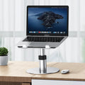 Silver aluminium laptop stand with height adjustment and rotating base for car use