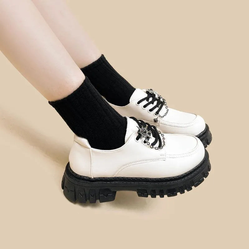 Women's Duke Asterism preppy loafers with a cross shoulder strap and metal detail.