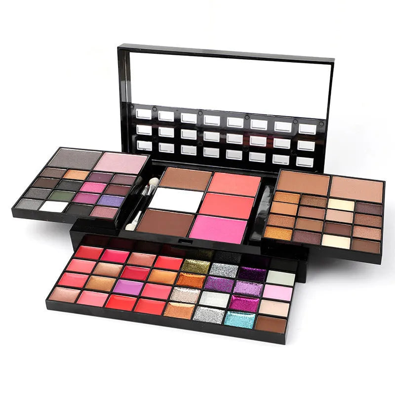 74 colour makeup combination palette open showing four layers of eyeshadows, lip glosses, and face powders with applicators