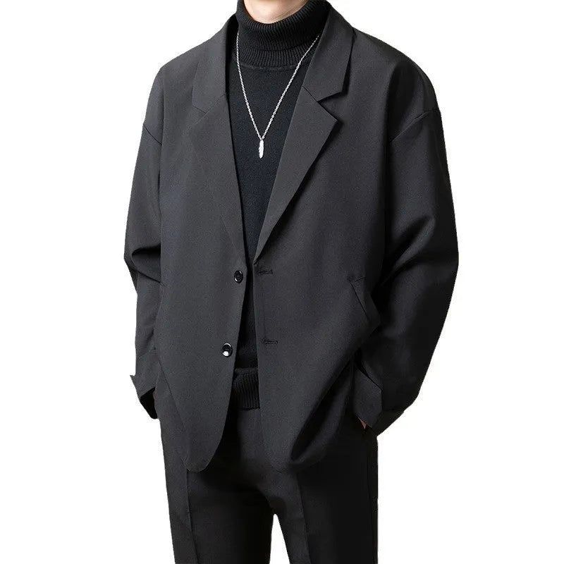 Men's loose fit casual suit jacket in apricot colour, showing long sleeves and button front.