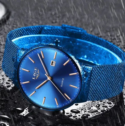Men's stainless steel watch with 40mm dial on a strap, shown in black, blue, and two-tone colour variations.