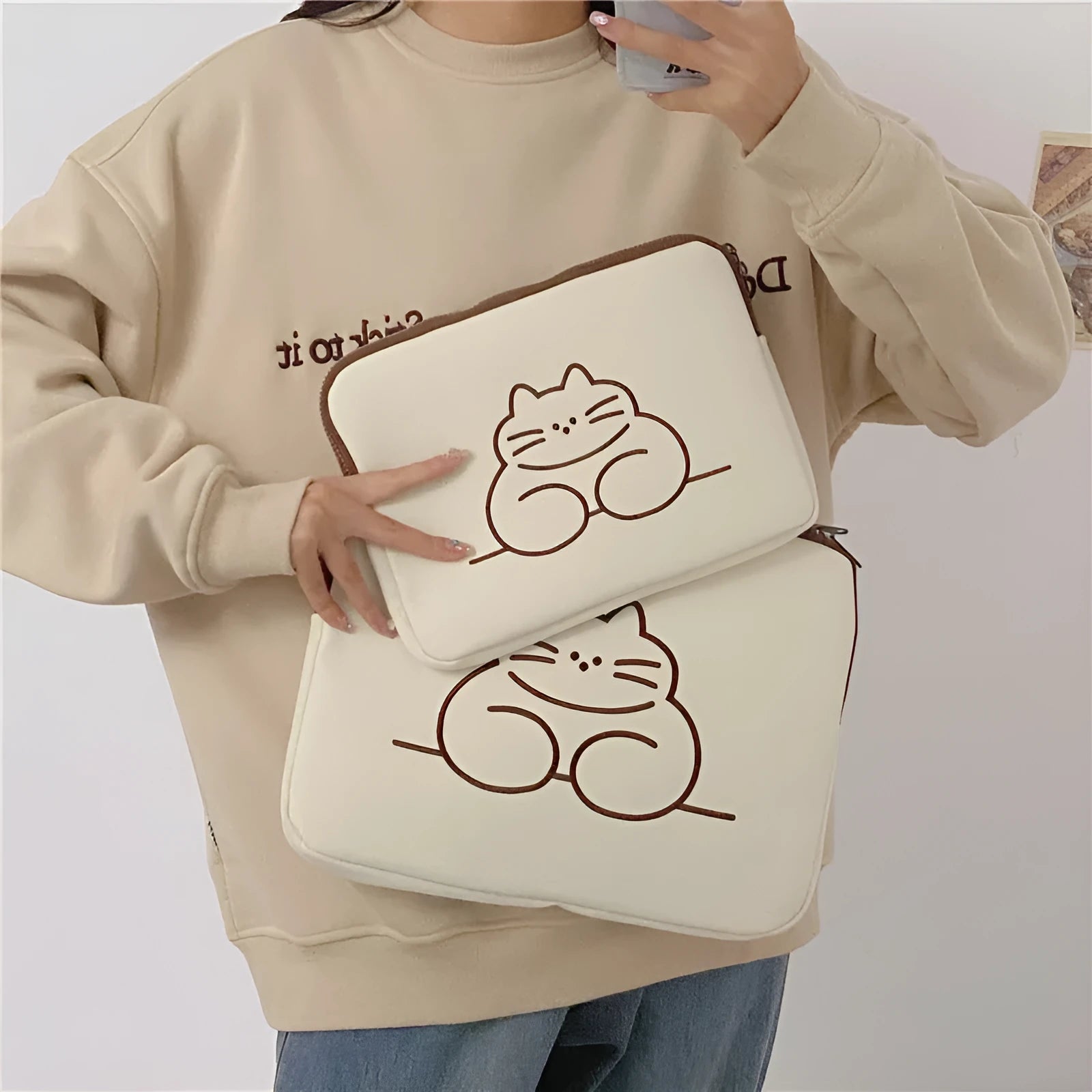 Embroidered animal design tablet sleeve with zipper closure in nylon fabric