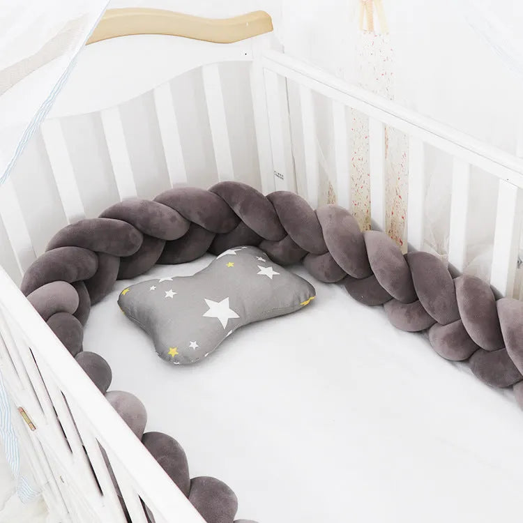 Braided knot baby crib bumper pillow in spandex velvet showing bendable design and colour options.