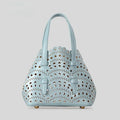 Hollow carved pattern tote messenger bag in horizontal square shape with three strap points