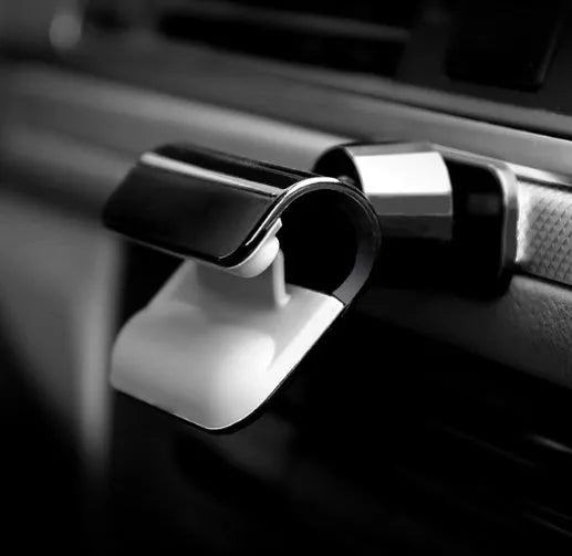 Black universal car phone holder showing 360-degree rotating mechanism and 3M adhesive base