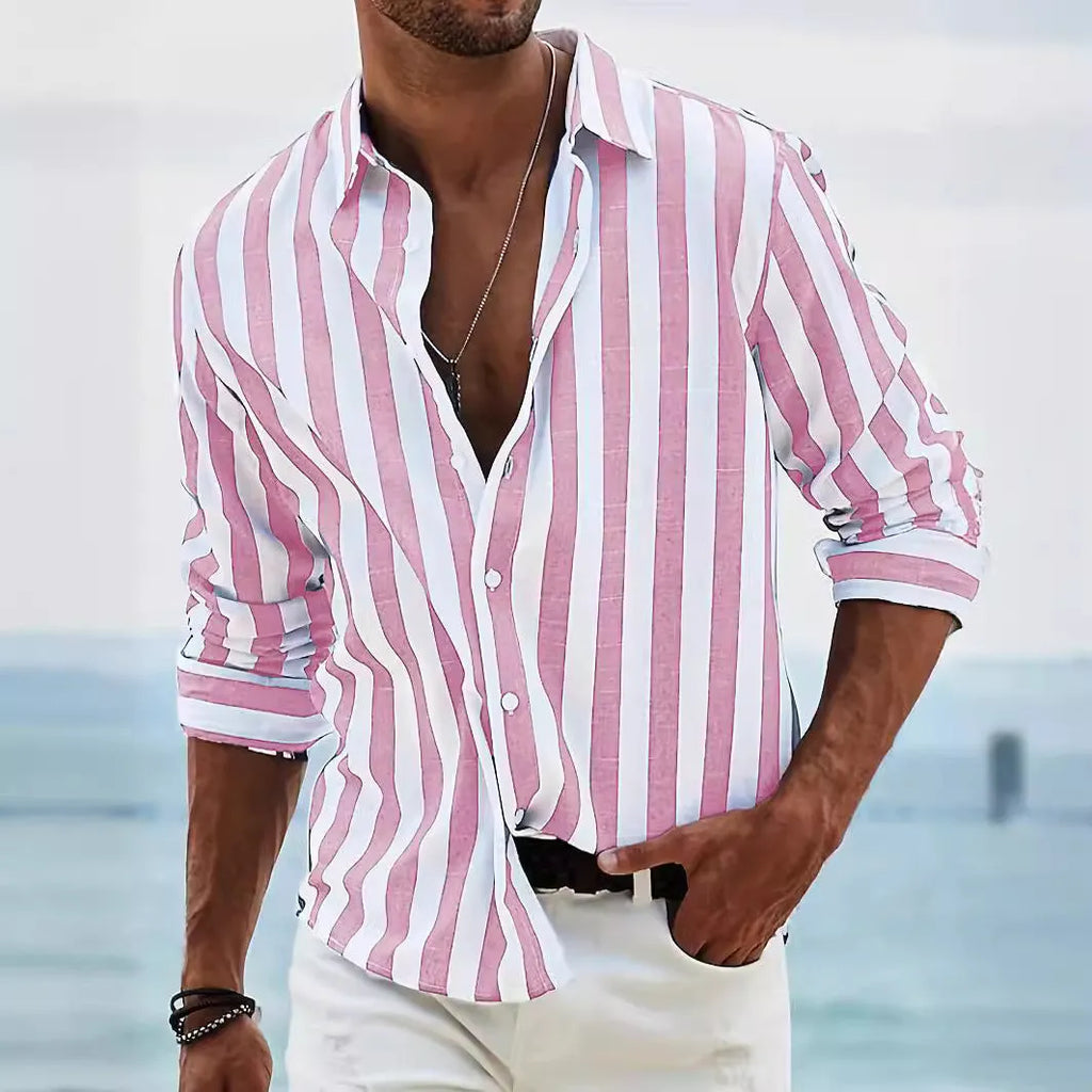 Man wearing a loose-fit, grey and white striped long-sleeved cardigan-style shirt.