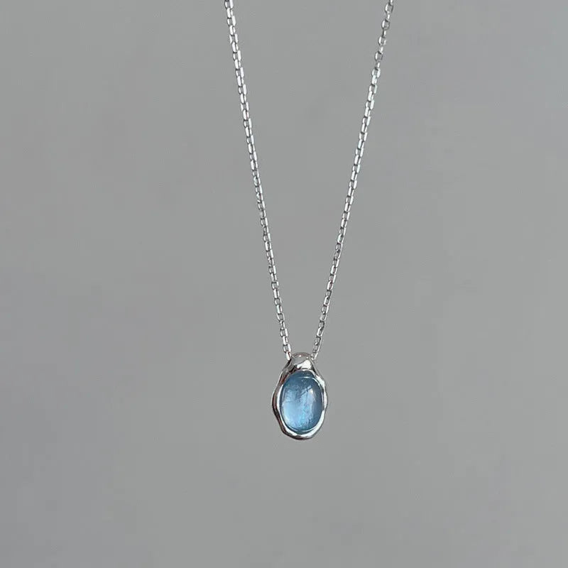 Navy blue water drop pendant necklace with adjustable cross chain in platinum colour