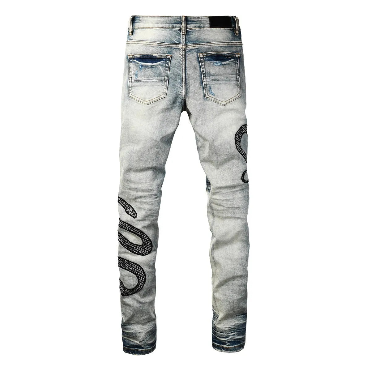 Distressed skinny jeans in mid-wash blue with street fashion styling and micro elasticity cotton fabric