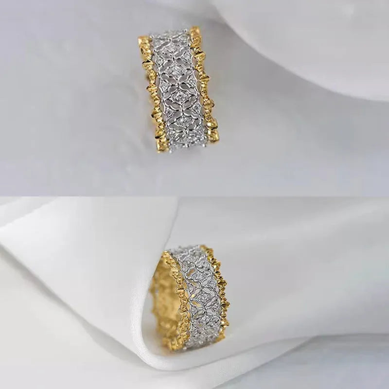 Geometric two-tone gold zircon fashion ring on a white background, showing its angular shape and round details.