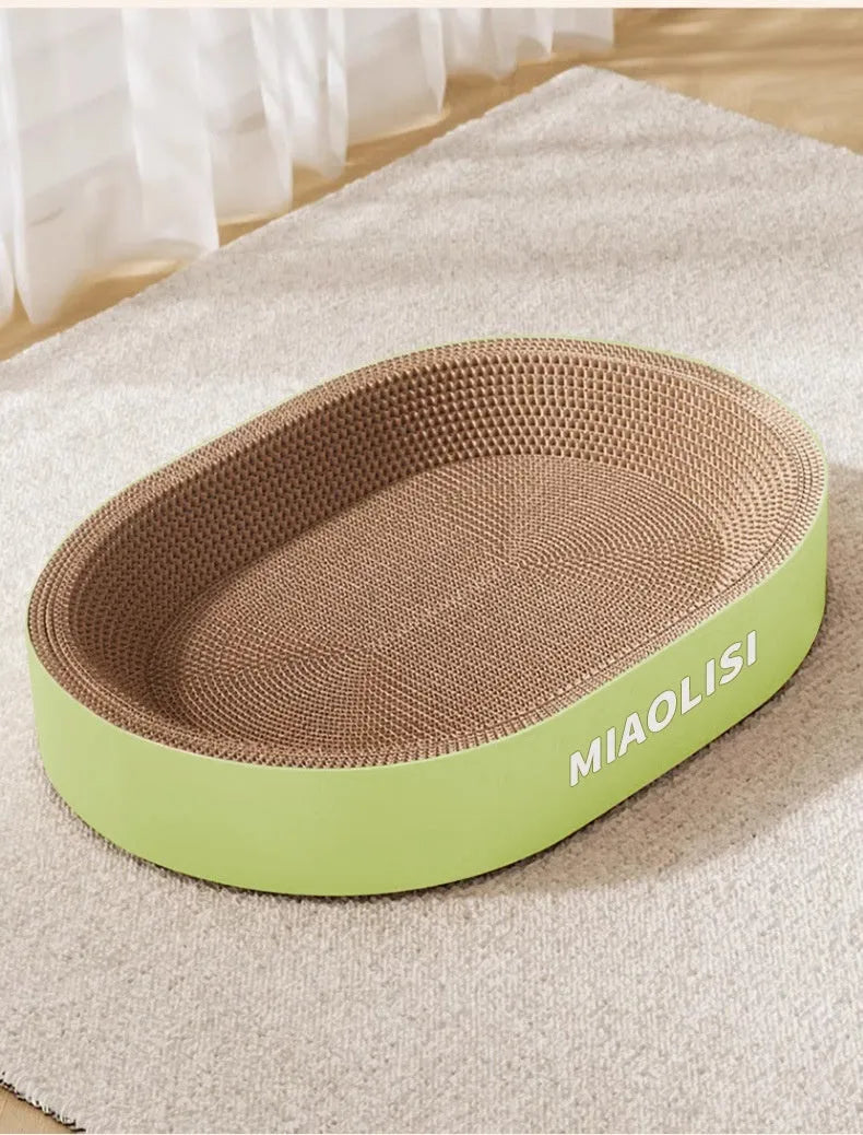 Green oval corrugated paper cat scratch board measuring 55 cm in diameter
