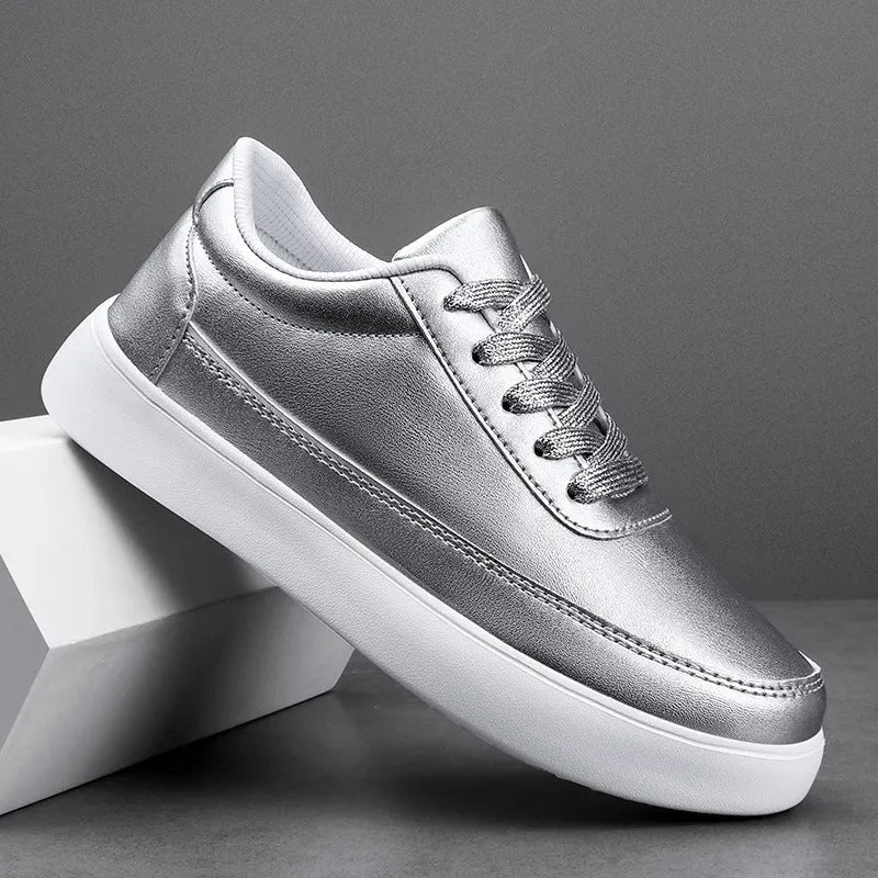 Women's white leather lace-up casual flat shoes on a plain background.