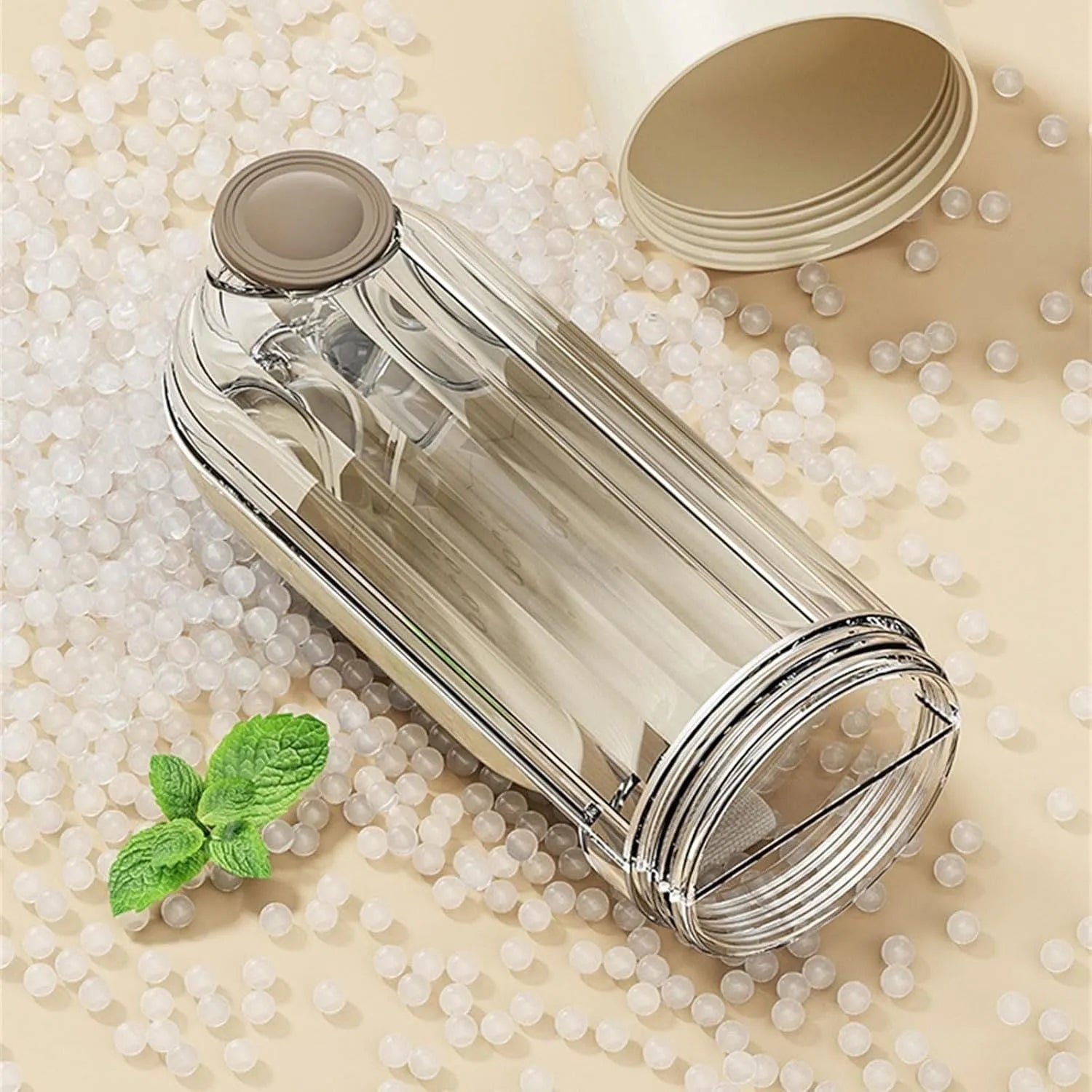 Green foldable dog water bottle with leak-proof lid and food container, shown extended for use.