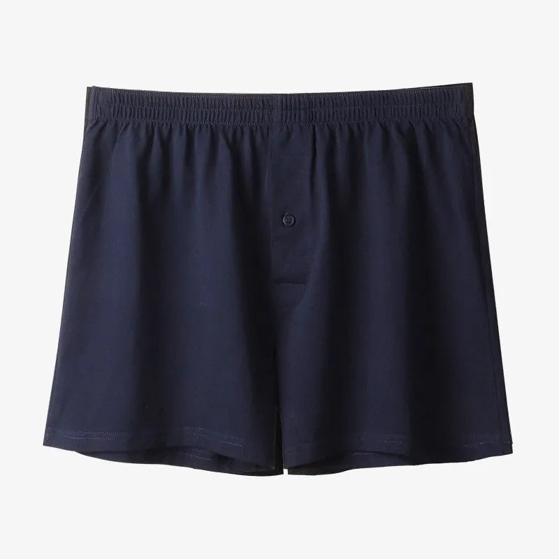 Men's black cotton loose boxer shorts with a high waist on a white background