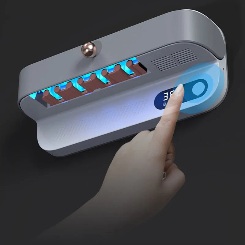 White wall-mounted smart toothbrush steriliser holder with USB charging port and control button.