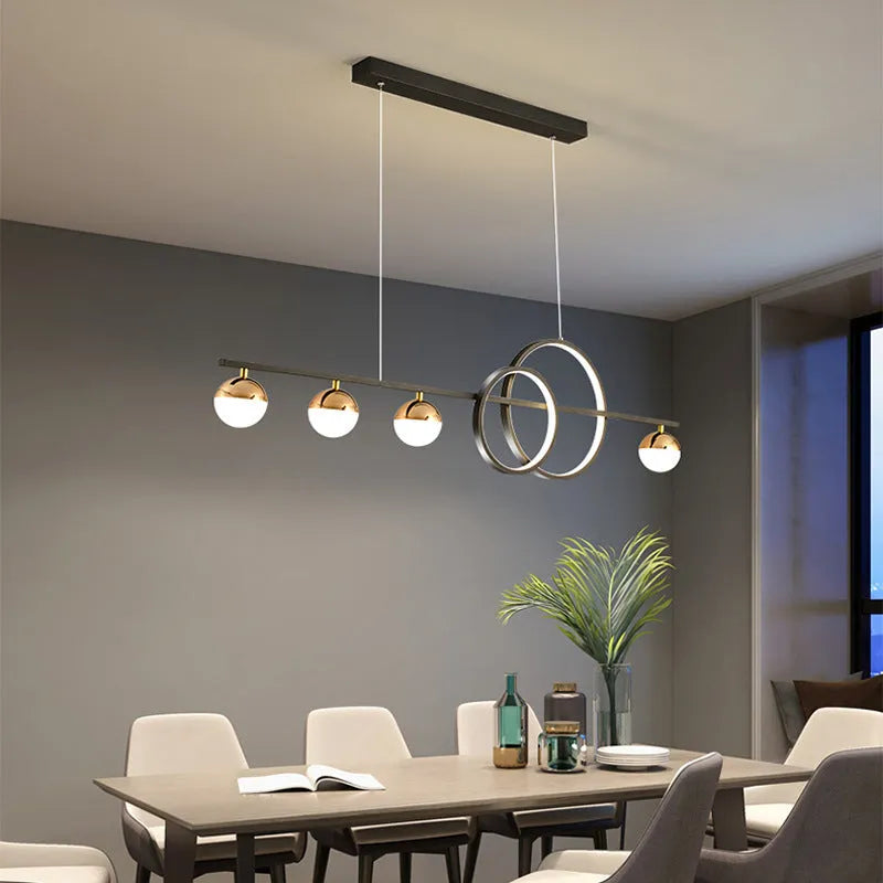 Modern rectangular aluminium ceiling light in black or gold with remote control for dimming.