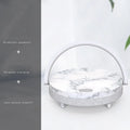 Wireless charging LED night light with Bluetooth speaker showing marble pattern finish and phone holder