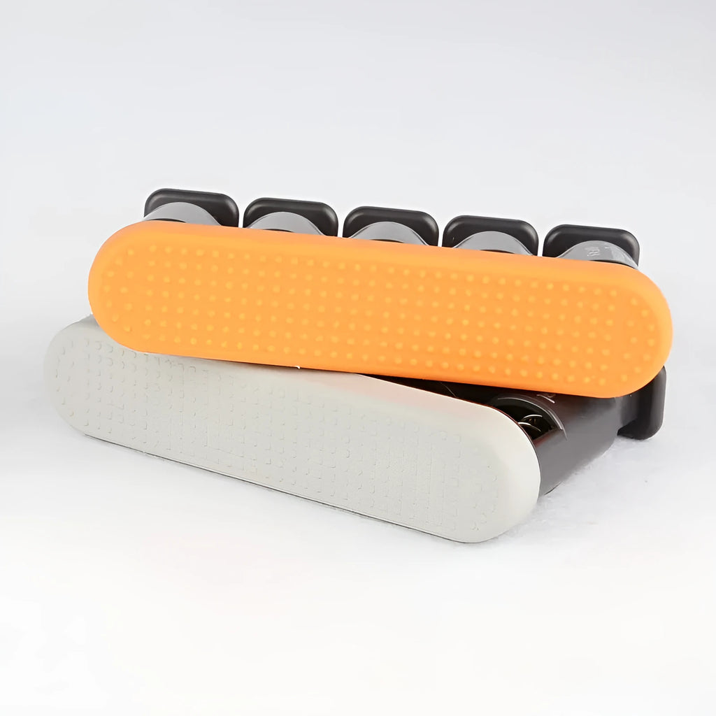 Grey or orange non-slip silicone fingerboard trainer for musician hand strength.