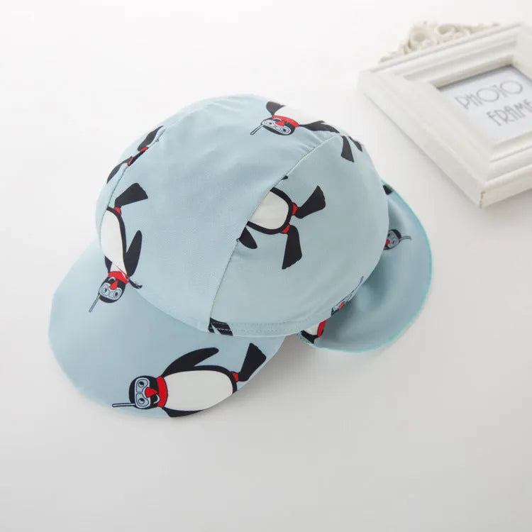 Boys' penguin print long sleeve swimming costume set with matching swim cap for sun protection