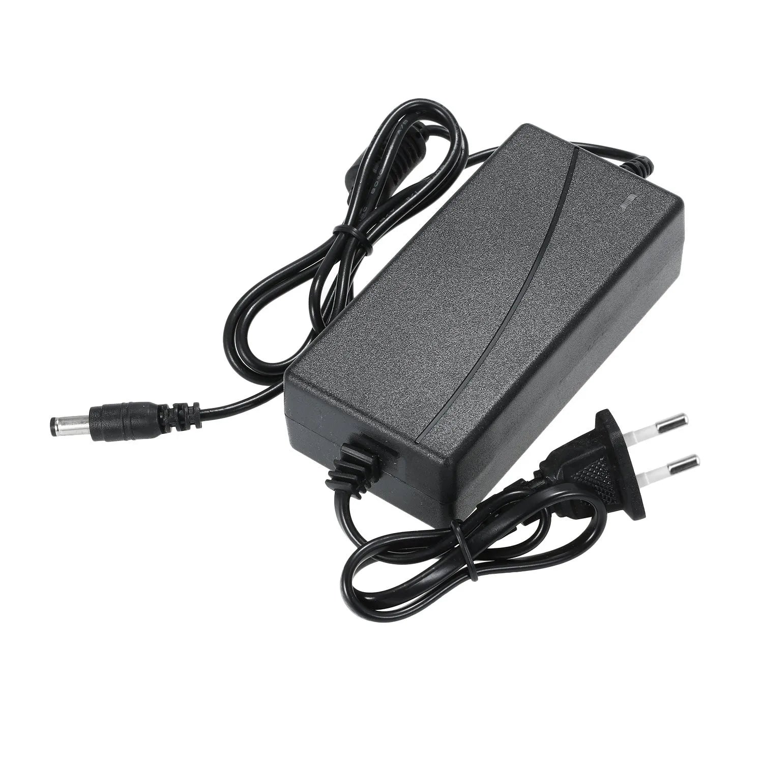 Stainless steel headlamp repair parts kit with power adapter options on a workshop bench.