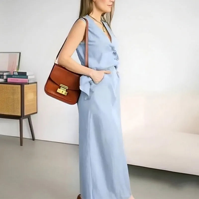 Women's casual white polyester vest and long skirt two-piece suit set on a hanger