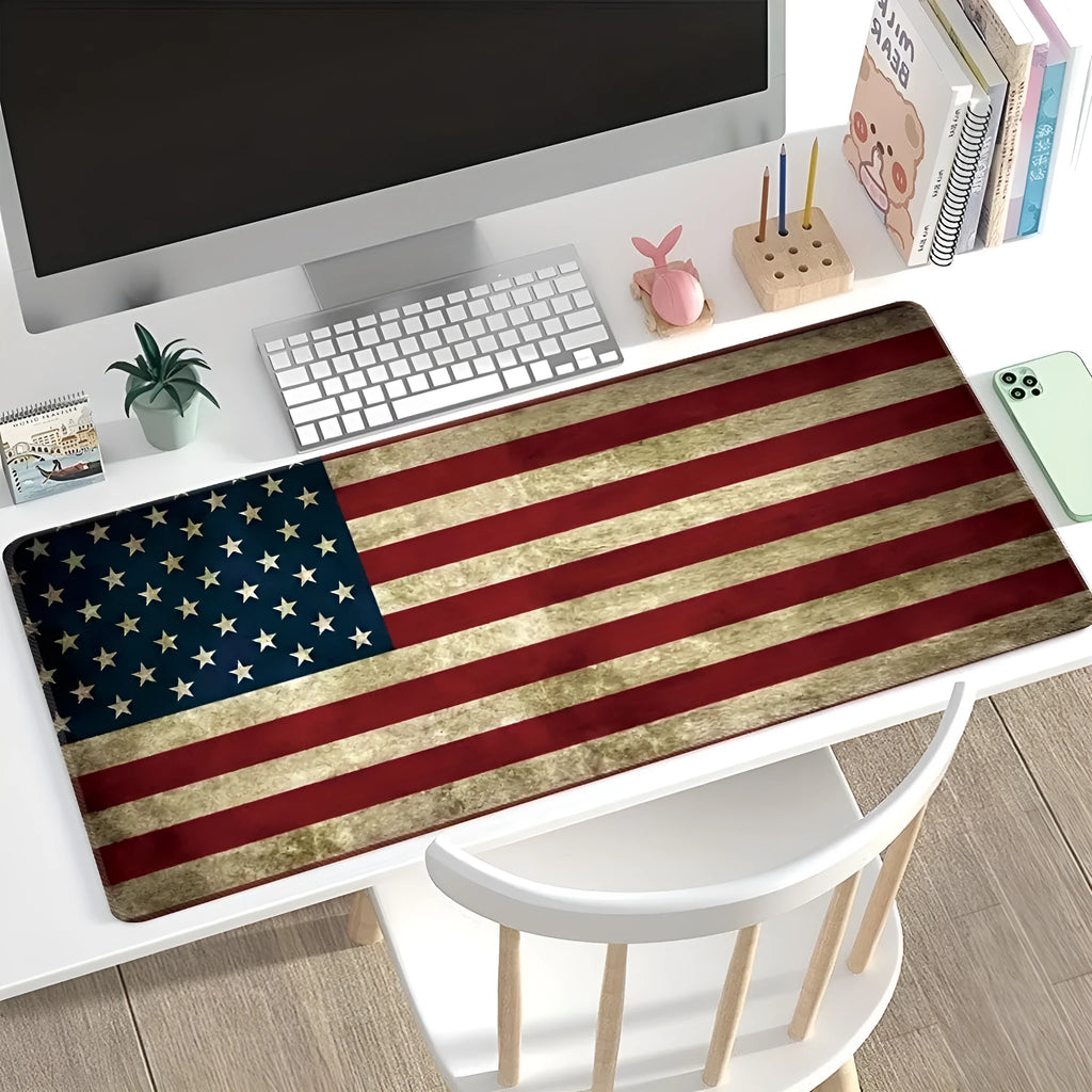 Large natural rubber non-slip mouse pad with decorative pattern on a desk.