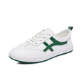 Women's leather Korean style sneakers with elastic band and round toe in black and white options