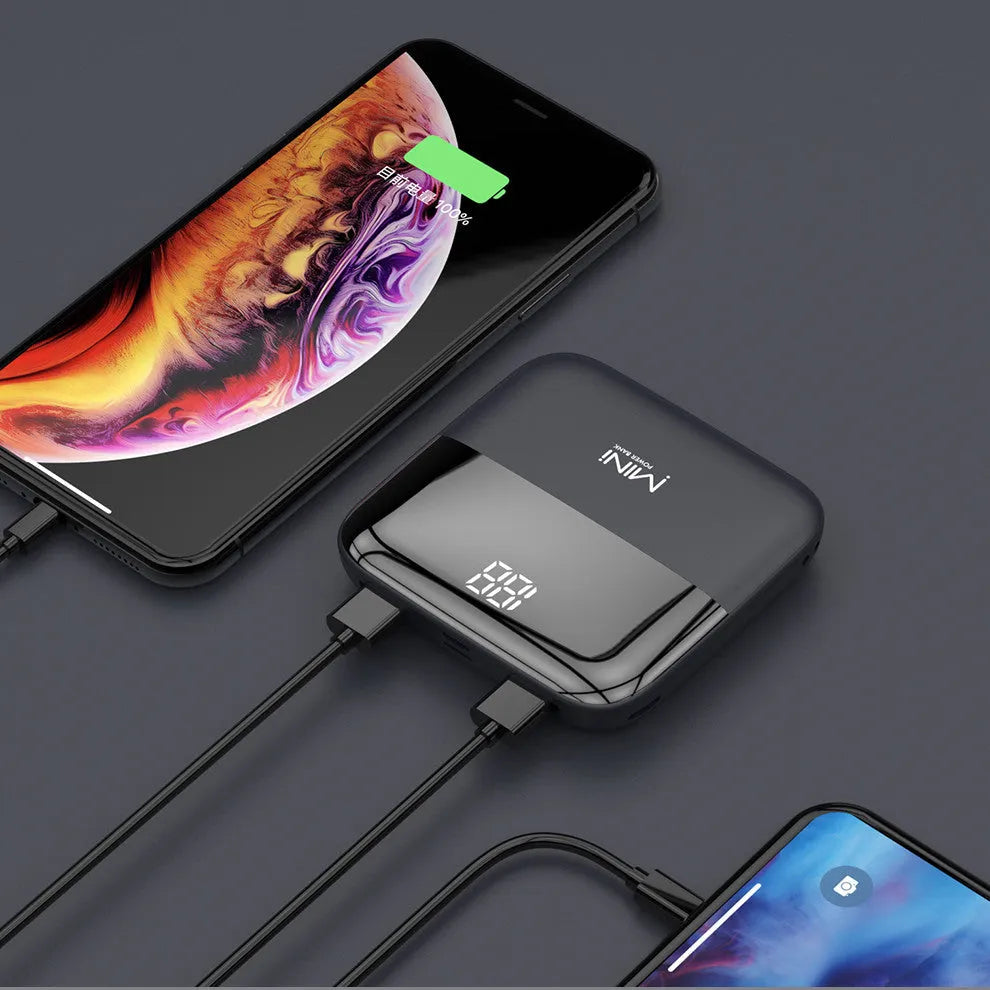 Black Android 10000mAh portable power bank with digital display showing battery percentage and dual USB ports.